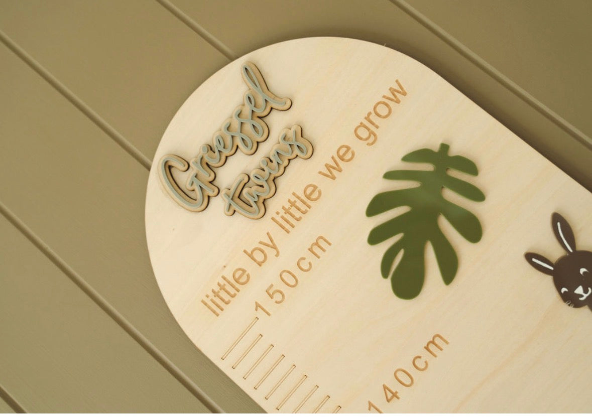 Close-up detail of personalised Forest & Friends wooden height chart