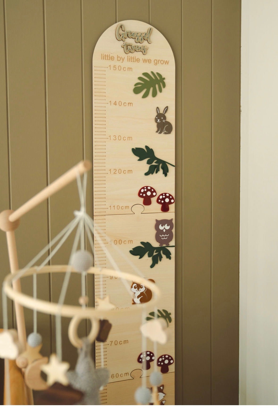 Forest & Friends personalised wooden height chart styled in a nursery