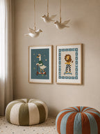 Goose and lion poster set styled together in a kids room